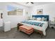 Inviting bedroom with plush carpeting, comfortable bed, bench, and plenty of natural light at 912 E Orchid Ln, Phoenix, AZ 85020