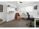 Spare bedroom with built in desk and shelves, accent chair, and neutral walls at 912 E Orchid Ln, Phoenix, AZ 85020