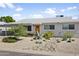 Charming single-story home featuring desert landscaping with various cacti and a light-colored exterior at 912 E Orchid Ln, Phoenix, AZ 85020