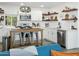 Beautiful kitchen with white cabinets, stainless steel appliances, and an island with seating at 912 E Orchid Ln, Phoenix, AZ 85020
