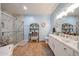 Stylishly designed bathroom with tiled floor, marble counter, and glass-enclosed shower at 10030 W Indian School Rd # 101, Phoenix, AZ 85037