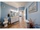 Bright bathroom with ample counter space, neutral paint and decor, and tile flooring at 10030 W Indian School Rd # 101, Phoenix, AZ 85037