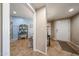 This view shows the doorway to the bathroom and the building's front door at 10030 W Indian School Rd # 101, Phoenix, AZ 85037