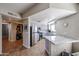 Updated kitchen features modern stainless steel appliances, granite countertops, and recessed lighting at 10030 W Indian School Rd # 101, Phoenix, AZ 85037