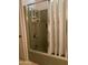 Bathroom shower with green walls, chrome hardware, white shower curtain, and built in shelves for storage at 120 N Val Vista Dr # 196, Mesa, AZ 85213