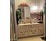 Bathroom vanity featuring floral decorations, a mirror, plenty of counter space, and an overhead light fixture at 120 N Val Vista Dr # 196, Mesa, AZ 85213