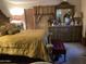 Comfortable bedroom features a cozy bed, mirrored vanity with flowers and personal touches at 120 N Val Vista Dr # 196, Mesa, AZ 85213