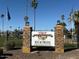 Age-qualified community: The Highlands at Brentwood sign with decorative stone pillars at entrance at 120 N Val Vista Dr # 196, Mesa, AZ 85213