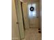 Hallway with multiple doors, tiled floors, a window with a white curtain and decorations around the trim at 120 N Val Vista Dr # 196, Mesa, AZ 85213