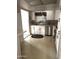 Bright kitchen features white cabinets, a stainless steel dishwasher, and a patterned floor at 120 N Val Vista Dr # 196, Mesa, AZ 85213