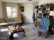 Inviting living room with a plush couch, classic furniture, and a large window at 120 N Val Vista Dr # 196, Mesa, AZ 85213