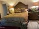 Elegant main bedroom features a decorative headboard, lamps, and plush bedding at 120 N Val Vista Dr # 196, Mesa, AZ 85213