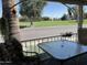 Outdoor patio area with view of a palm tree and manicured lawn area and a table with patio furniture at 120 N Val Vista Dr # 196, Mesa, AZ 85213