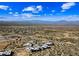 Expansive aerial view showcases a new desert community with mountain range backdrop under a bright blue sky at 12746 E Casitas Del Rio E Dr, Scottsdale, AZ 85255