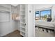 Walk-in closet providing ample storage, adjoining a well-appointed bedroom with scenic outdoor views at 12746 E Casitas Del Rio E Dr, Scottsdale, AZ 85255