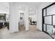 Bright and airy hallway leading to kitchen, bathroom, and study at 12746 E Casitas Del Rio E Dr, Scottsdale, AZ 85255