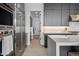Gourmet kitchen featuring stainless steel appliances, quartz countertops, and modern gray cabinets at 12746 E Casitas Del Rio E Dr, Scottsdale, AZ 85255