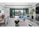 Comfortable living room with sliding glass doors that open to the outdoor living area at 12746 E Casitas Del Rio E Dr, Scottsdale, AZ 85255