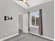 Inviting bedroom with gray walls, carpet, and a ceiling fan, and an open door to the closet at 1332 W Blue Ridge Ct, Chandler, AZ 85248