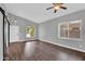 Bright bedroom features wood floors, vaulted ceilings, and natural light from two large windows at 1332 W Blue Ridge Ct, Chandler, AZ 85248