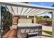 Relaxing hot tub beneath a shaded pergola, inviting outdoor enjoyment and leisure at 1332 W Blue Ridge Ct, Chandler, AZ 85248