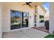 Covered patio features concrete flooring, outdoor grill, ceiling fan, and sliding glass door access at 1332 W Blue Ridge Ct, Chandler, AZ 85248
