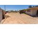 Side view of a spacious backyard with a boat, trailer, and a shed at 1351 E Ellis Cir, Mesa, AZ 85203