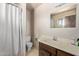 Bathroom with a sink, toilet, shower, and standard vanity with a mirror at 1351 E Ellis Cir, Mesa, AZ 85203