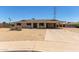 Single story home featuring a large covered carport and desert landscaping at 1351 E Ellis Cir, Mesa, AZ 85203