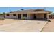 Single story home featuring a large covered carport and desert landscaping at 1351 E Ellis Cir, Mesa, AZ 85203