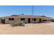 Single story home featuring a large covered carport and desert landscaping at 1351 E Ellis Cir, Mesa, AZ 85203