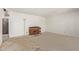 Empty living room featuring a large window and a piano at 1351 E Ellis Cir, Mesa, AZ 85203