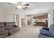 Open floor plan connecting the living room to the kitchen with easy access to appliances and counterspace at 1351 E Ellis Cir, Mesa, AZ 85203