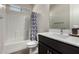 Bathroom features a sleek vanity, mirror, and a shower-tub combination with stylish curtain at 1360 E Avenida Kino --, Casa Grande, AZ 85122