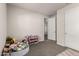 Bright bedroom with soft lighting, ample toy storage, and neutral tones creating a calming space at 1360 E Avenida Kino --, Casa Grande, AZ 85122