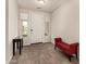 Inviting entryway featuring wood-look flooring, a white door, and a red bench at 1360 E Avenida Kino --, Casa Grande, AZ 85122