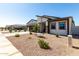 Single-story home featuring a modern garage door, low-maintenance landscaping, and neutral color palette at 1360 E Avenida Kino --, Casa Grande, AZ 85122