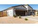 Single-story home featuring a modern garage door, low-maintenance landscaping, and neutral color palette at 1360 E Avenida Kino --, Casa Grande, AZ 85122