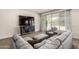 Comfortable living room featuring a sectional sofa, sliding glass doors and tile floors at 1360 E Avenida Kino --, Casa Grande, AZ 85122
