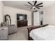 Main bedroom features a ceiling fan, TV on dresser, and an open doorway at 1360 E Avenida Kino --, Casa Grande, AZ 85122
