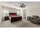 Spacious main bedroom with a ceiling fan, carpeted floors, and large windows at 1360 E Avenida Kino --, Casa Grande, AZ 85122