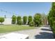 Beautiful backyard with green lawn, mature trees, and a paved patio, perfect for outdoor enjoyment at 1401 E Drake Dr, Tempe, AZ 85283