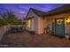 Charming home with outdoor seating and a welcoming front entrance adorned with a decorative wreath at 1401 E Drake Dr, Tempe, AZ 85283