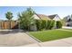 A well-maintained home exterior with lush greenery, offering privacy and curb appeal at 1401 E Drake Dr, Tempe, AZ 85283