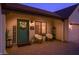 Inviting front entrance with charming decor, including a wreath and a 'HOME' sign and a seating area at 1401 E Drake Dr, Tempe, AZ 85283
