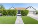 Charming single-story home showcases manicured landscaping, inviting entryway, and attached garage at 1401 E Drake Dr, Tempe, AZ 85283