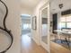 Light streams through the windows of a hallway with an open doorway to the home office at 1401 E Drake Dr, Tempe, AZ 85283