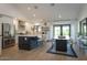 Open concept kitchen featuring a large island, stainless steel appliances, and a dining area at 1401 E Drake Dr, Tempe, AZ 85283