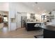 Modern kitchen featuring stainless steel appliances, a large island with seating, and wood flooring at 1401 E Drake Dr, Tempe, AZ 85283