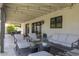 Relaxing covered patio with ample seating, perfect for outdoor entertaining and enjoying the backyard view at 1401 E Drake Dr, Tempe, AZ 85283